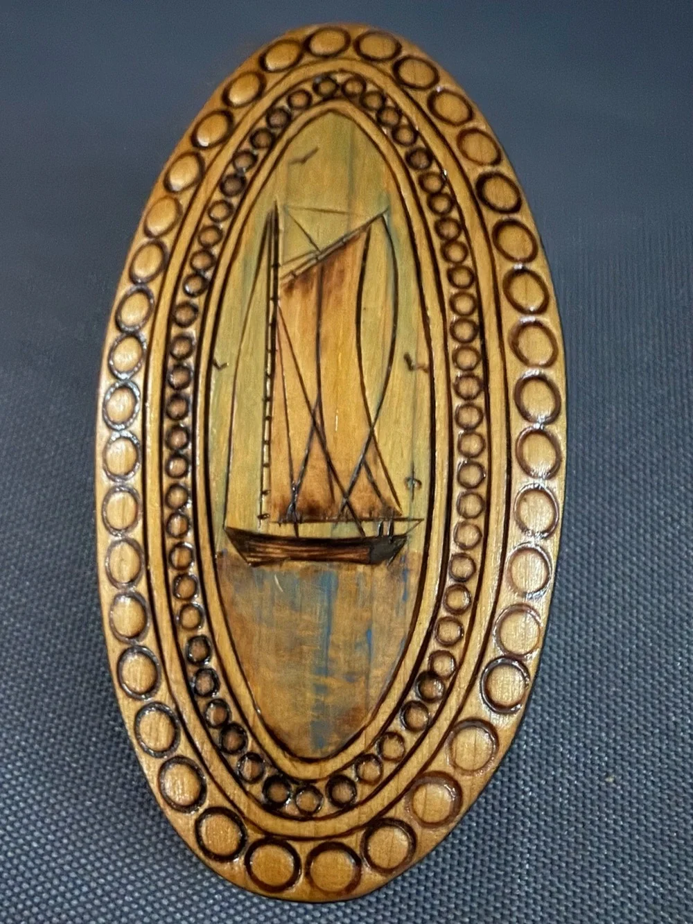 Hand-Carved Oval Sailing Boat Brooch in Warm Wood Tones